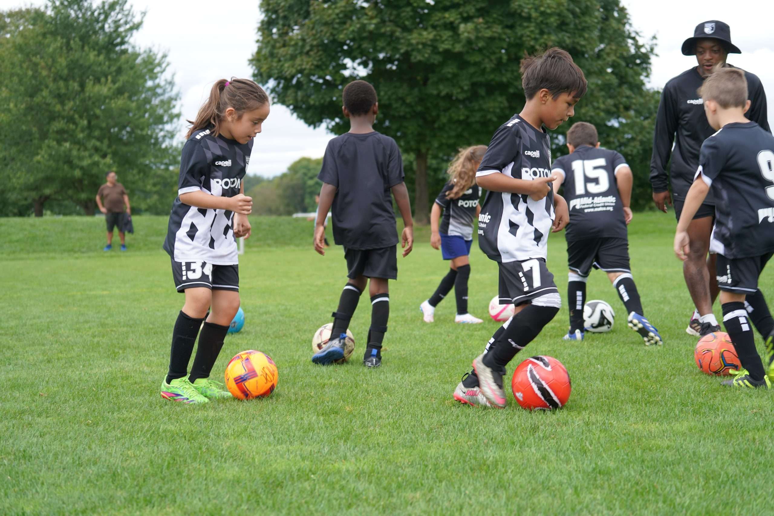 young boys and girls playing soccer